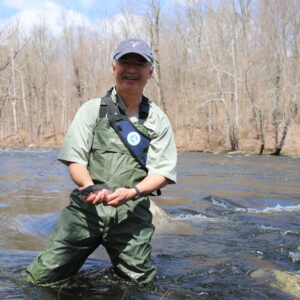 Augusto Russell catches trout while fly fishing