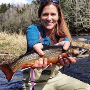 Angela Ziogas, Cross Current Insurance Advisor shows Brook Trout catch