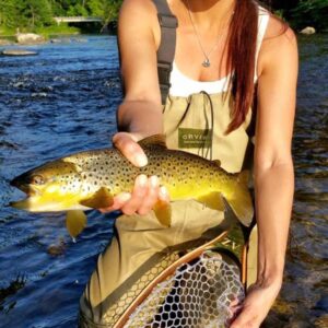 Angela Ziogas, Cross Current Insurance Advisor catches Brown Trout in Farmington River