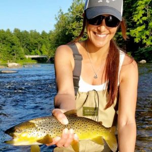 Angela Ziogas, Cross Current Insurance Advisor catches Brown Trout in Farmington River