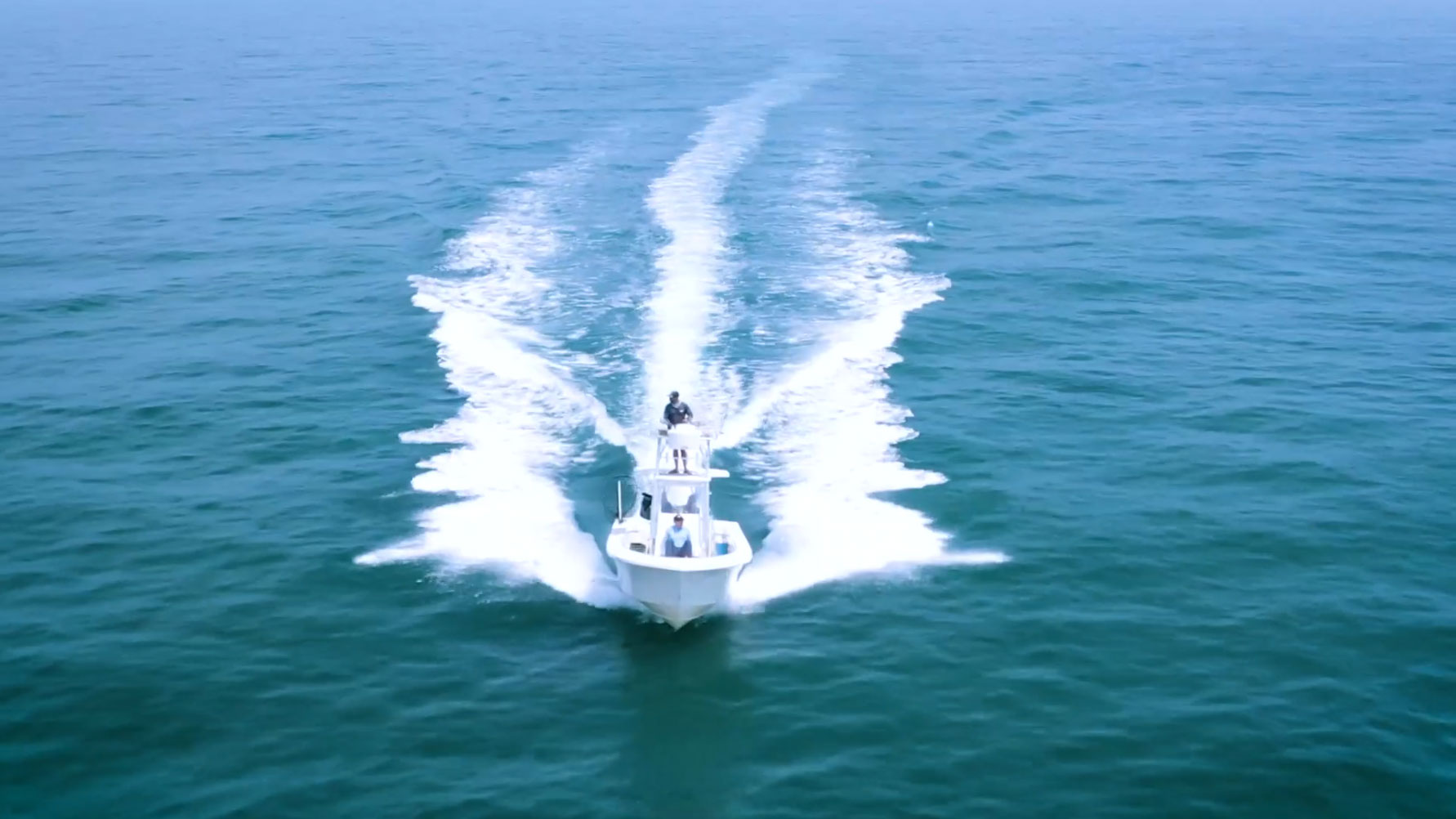 Boat on the ocean with two anglers