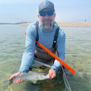 Joe get's his first striper on Cape Cod!