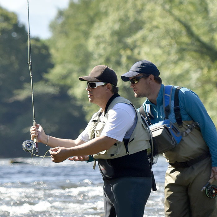 fly fishing guide and his client