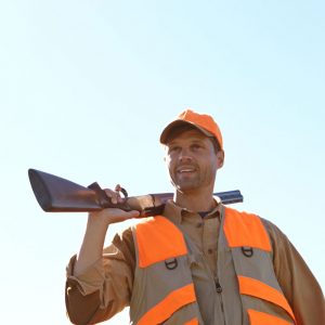 hunter with a gun on his shoulder