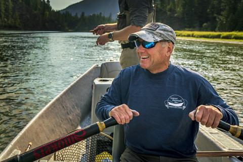 Tim Linehan, owner of Linehan Outfitting rowing a boat on the river