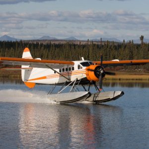 Bush plane landing in a lake in Alaska