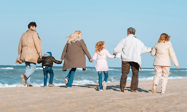 Family walking on the beach