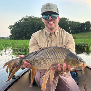 Paul Wagner, Cross Current Insurance guide with a Carp